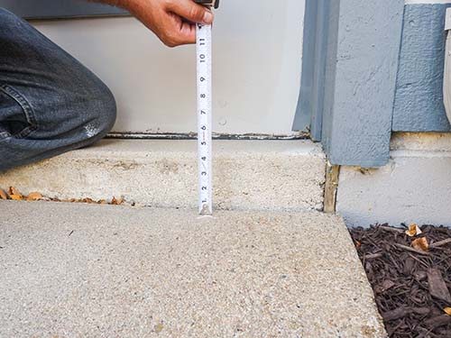 Driveway sinking near garage